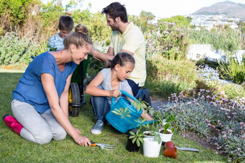 Gardener maintaining a lush green lawn